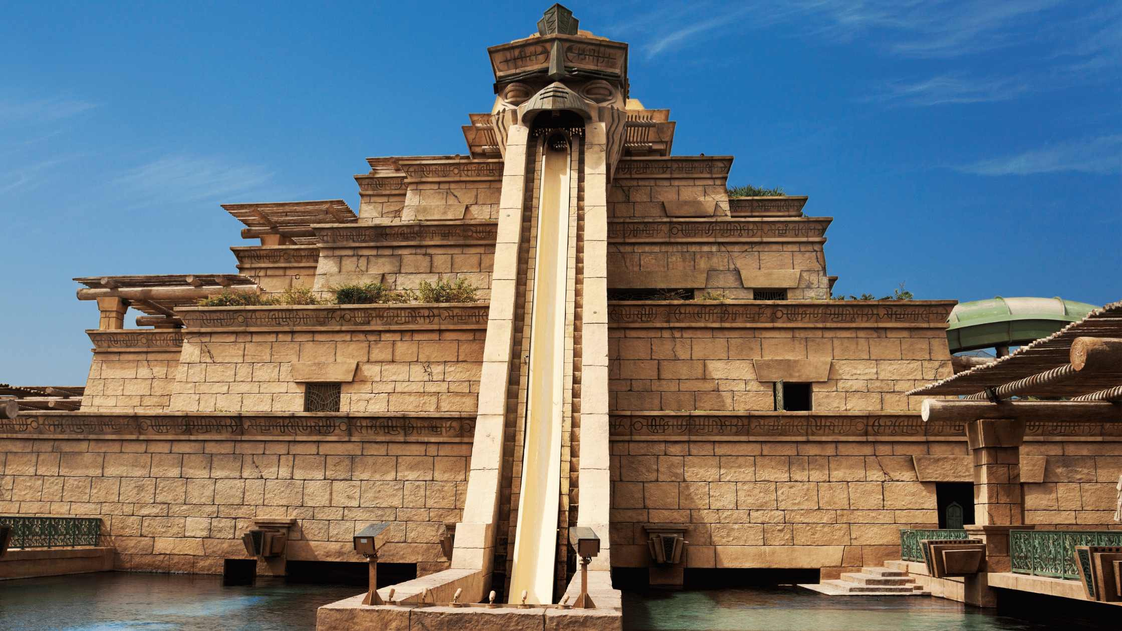 Aerial view of Atlantis Aquaventure Waterpark with slides, lazy rivers, and beach access.