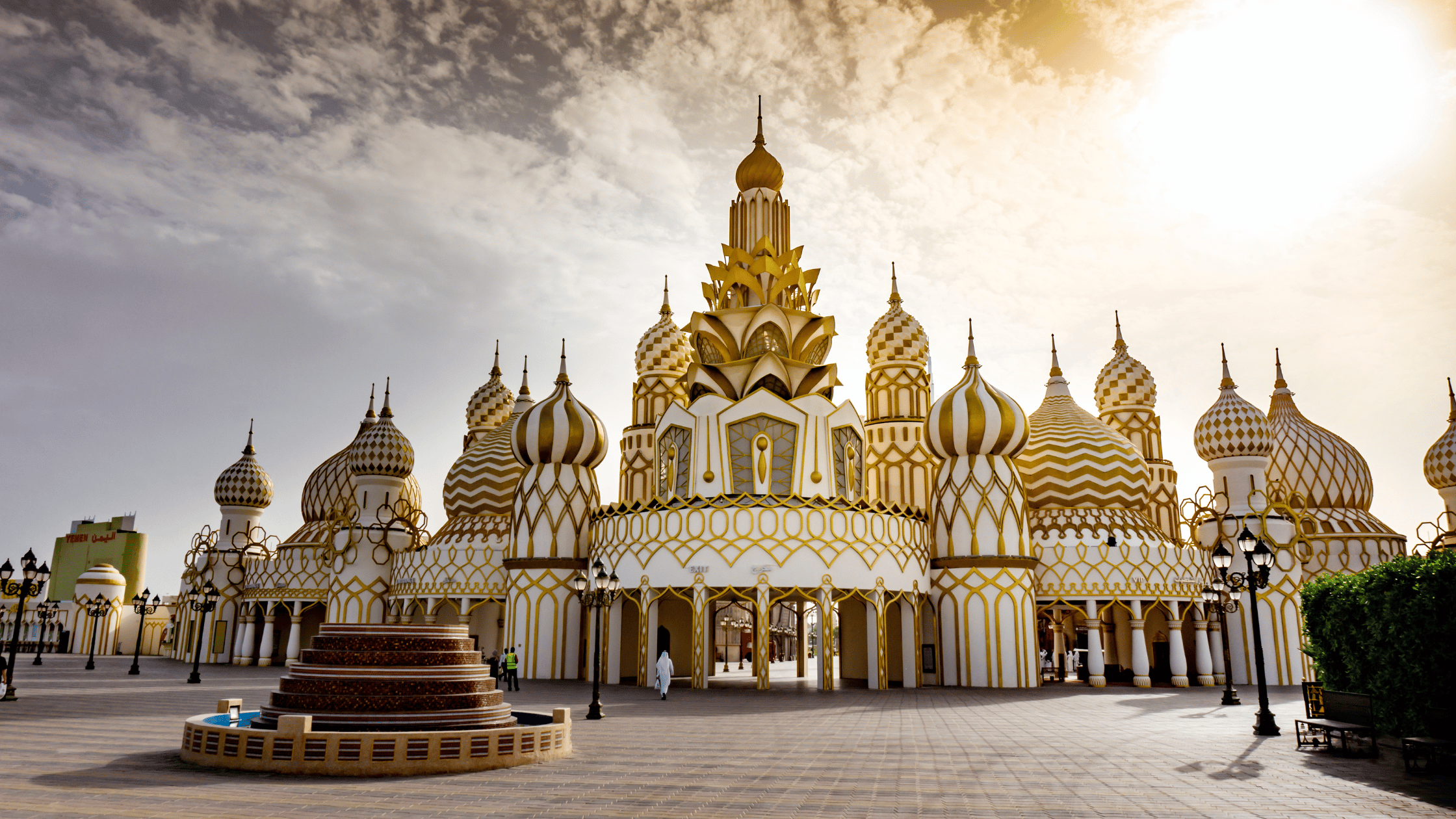 Pavilions representing multiple countries with lights and live performances at Global Village.