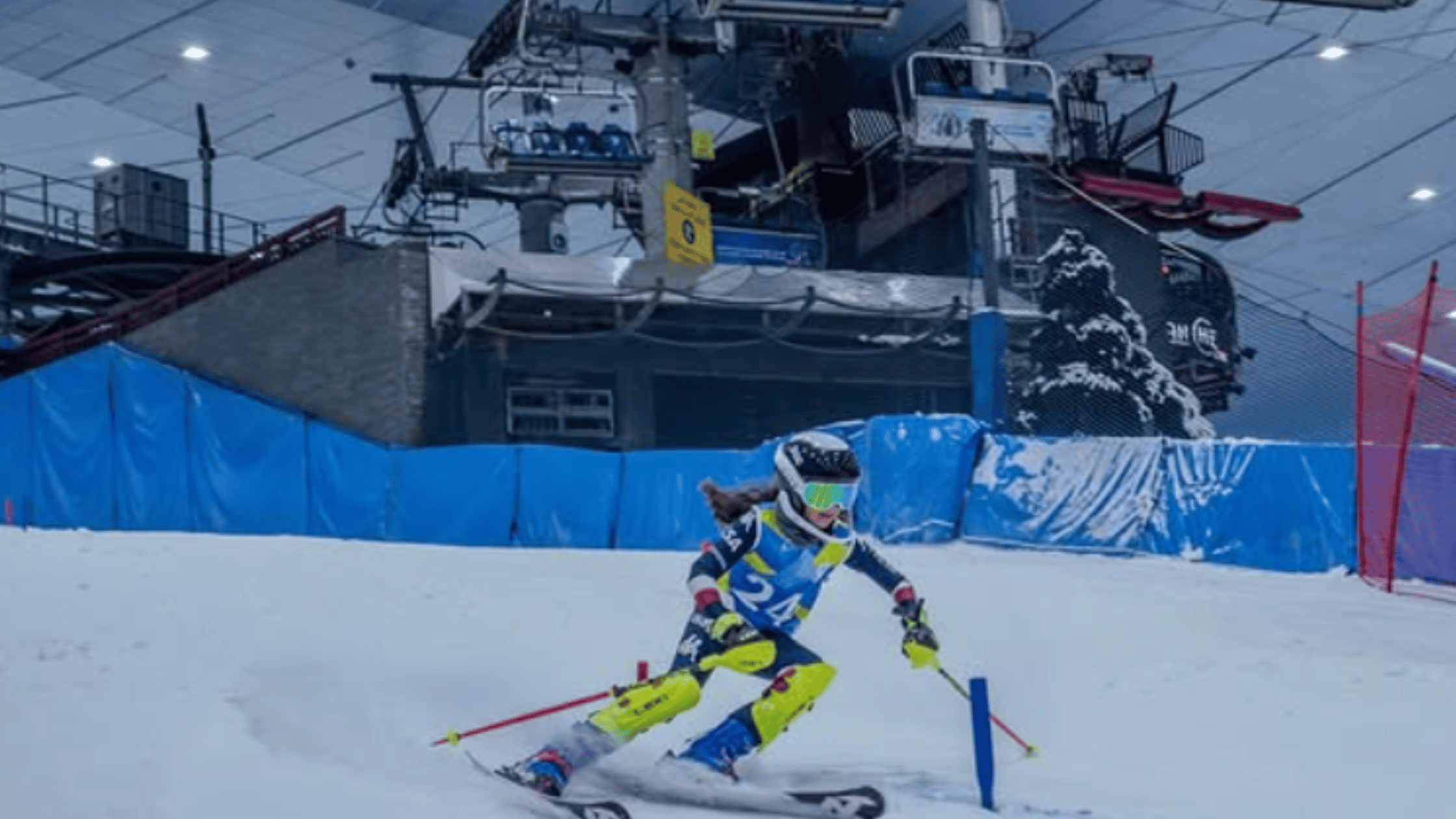 A family enjoying snow activities at Ski Dubai, complete with snowman building and ice slides.
